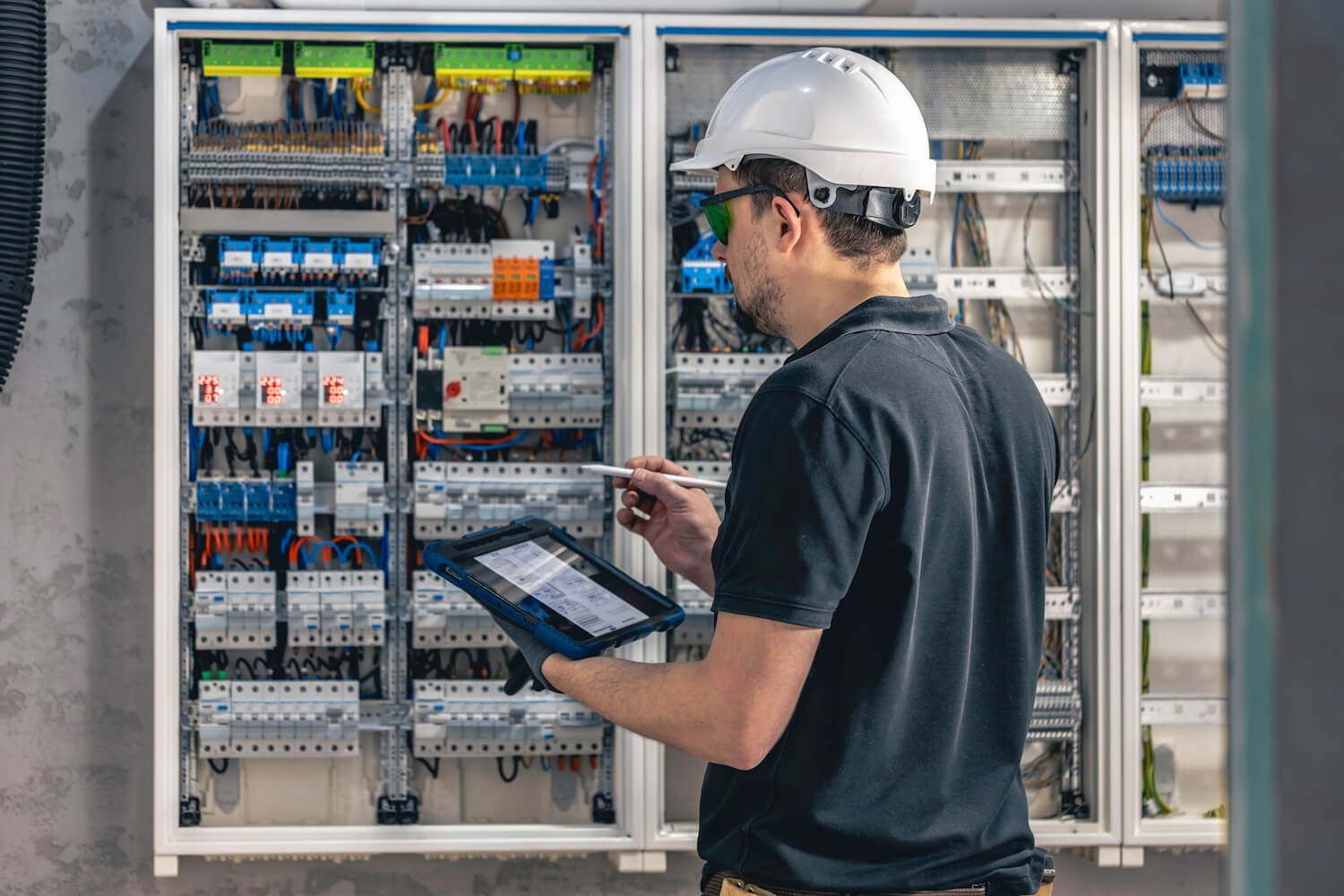 PDC electrician working on building automation installation